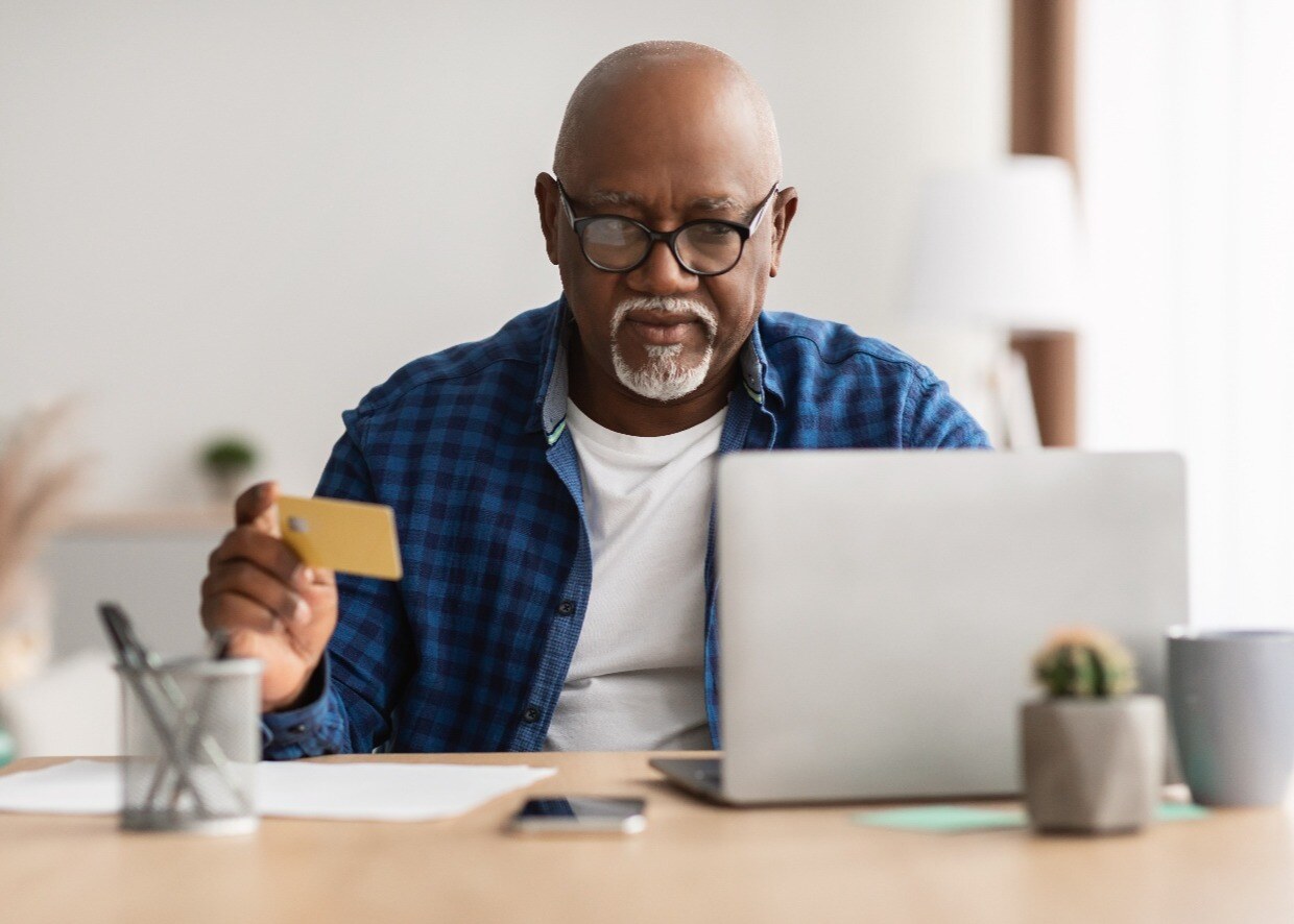 senior-black-male-shopping-with-credit-card-using-2022-01-05-02-46-18-utc-1