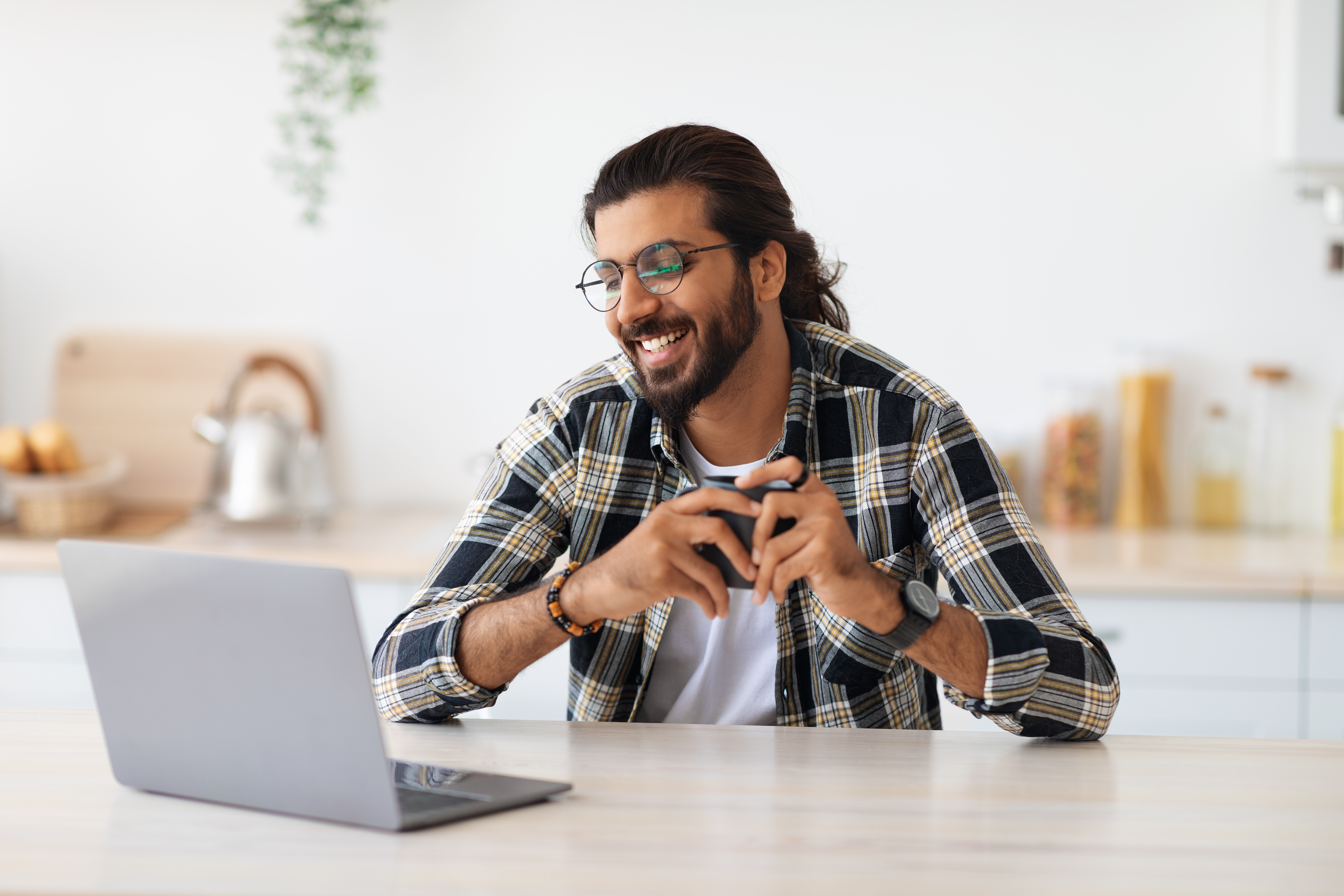 cheerful-indian-guy-looking-for-job-online-at-home-2022-01-18-23-59-01-utc