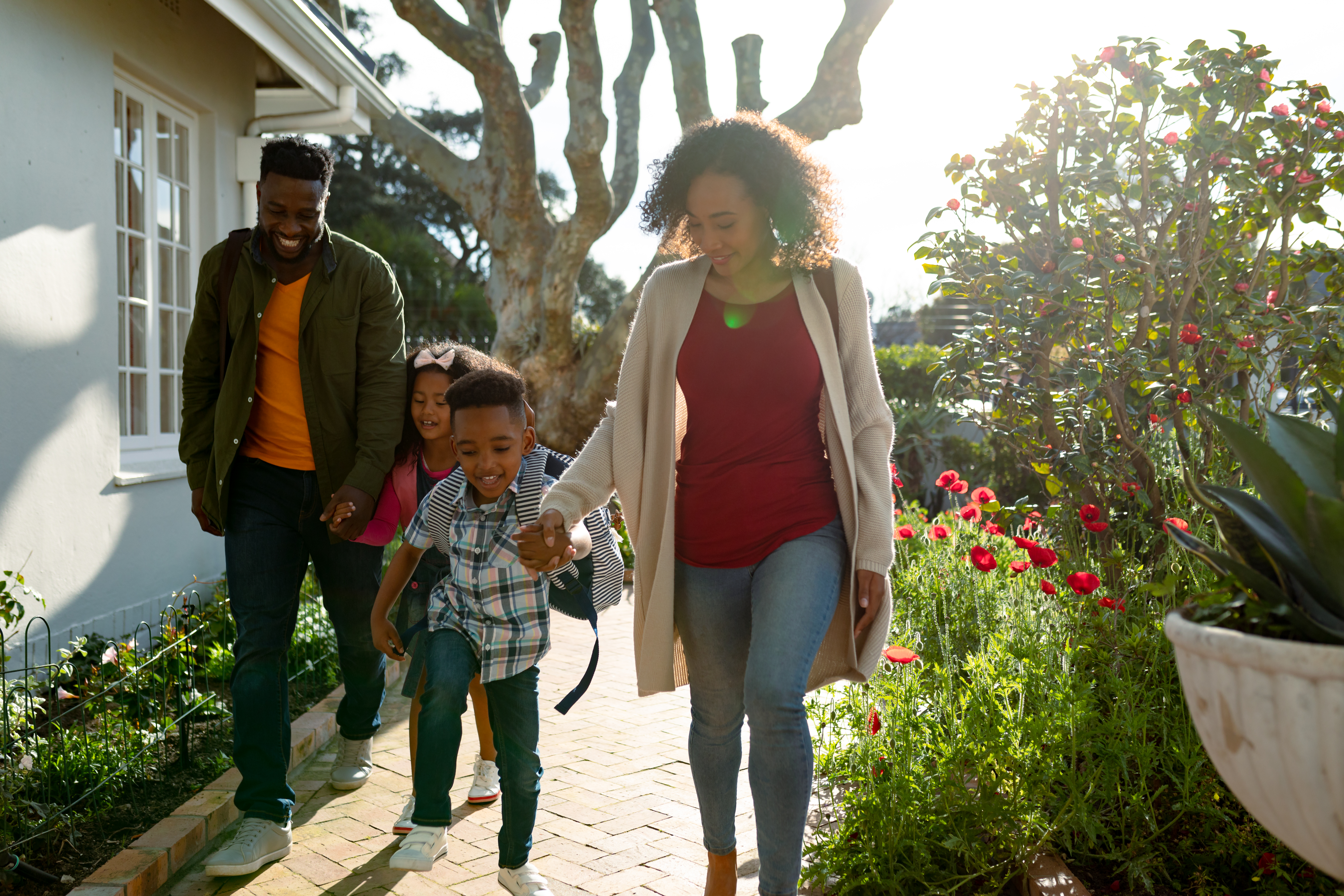happy-african-american-family-holding-hands-and-wa-2022-01-19-00-02-55-utc