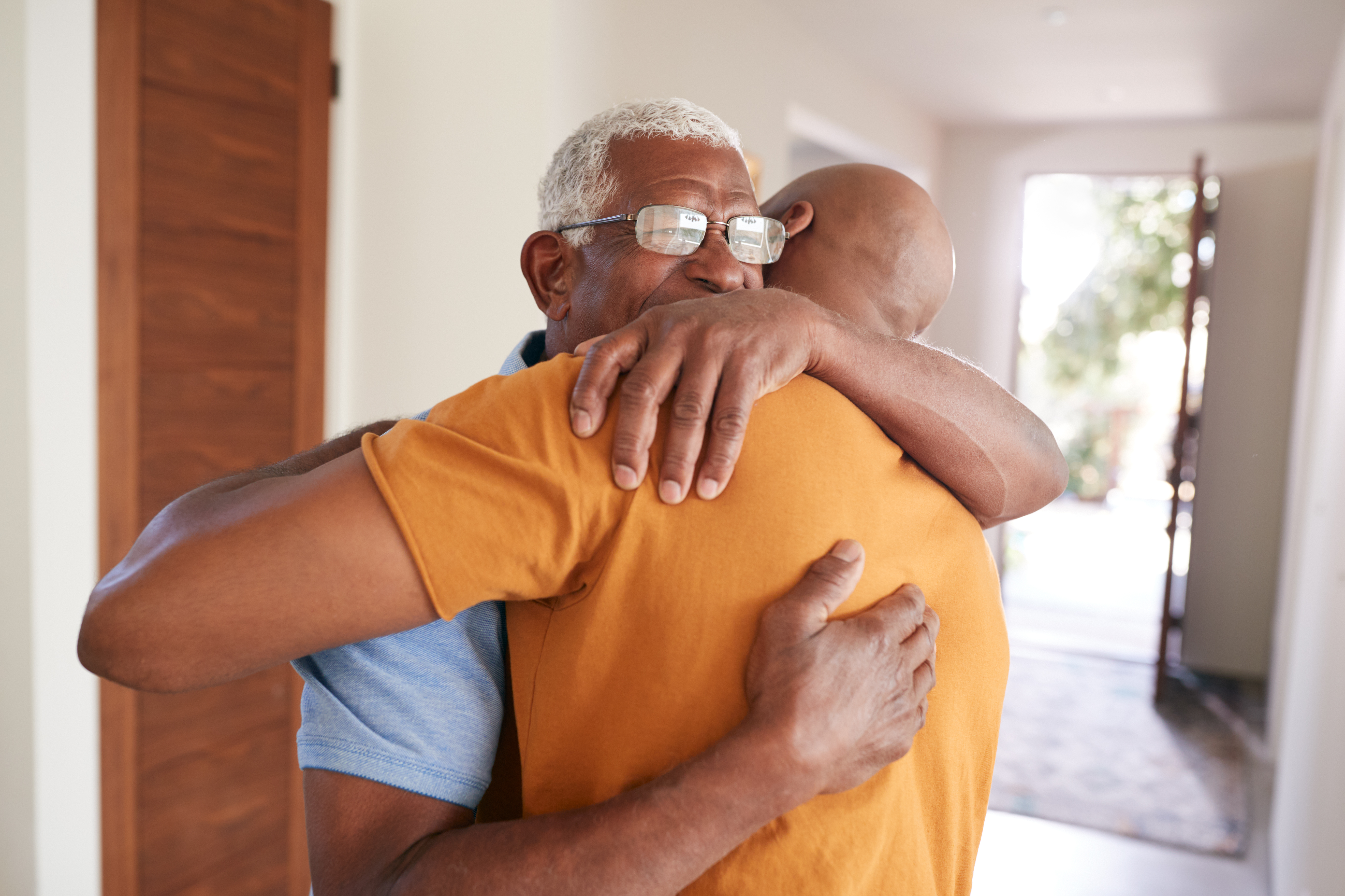 loving-senior-father-hugging-adult-son-indoors-at-2022-02-02-03-59-22-utc